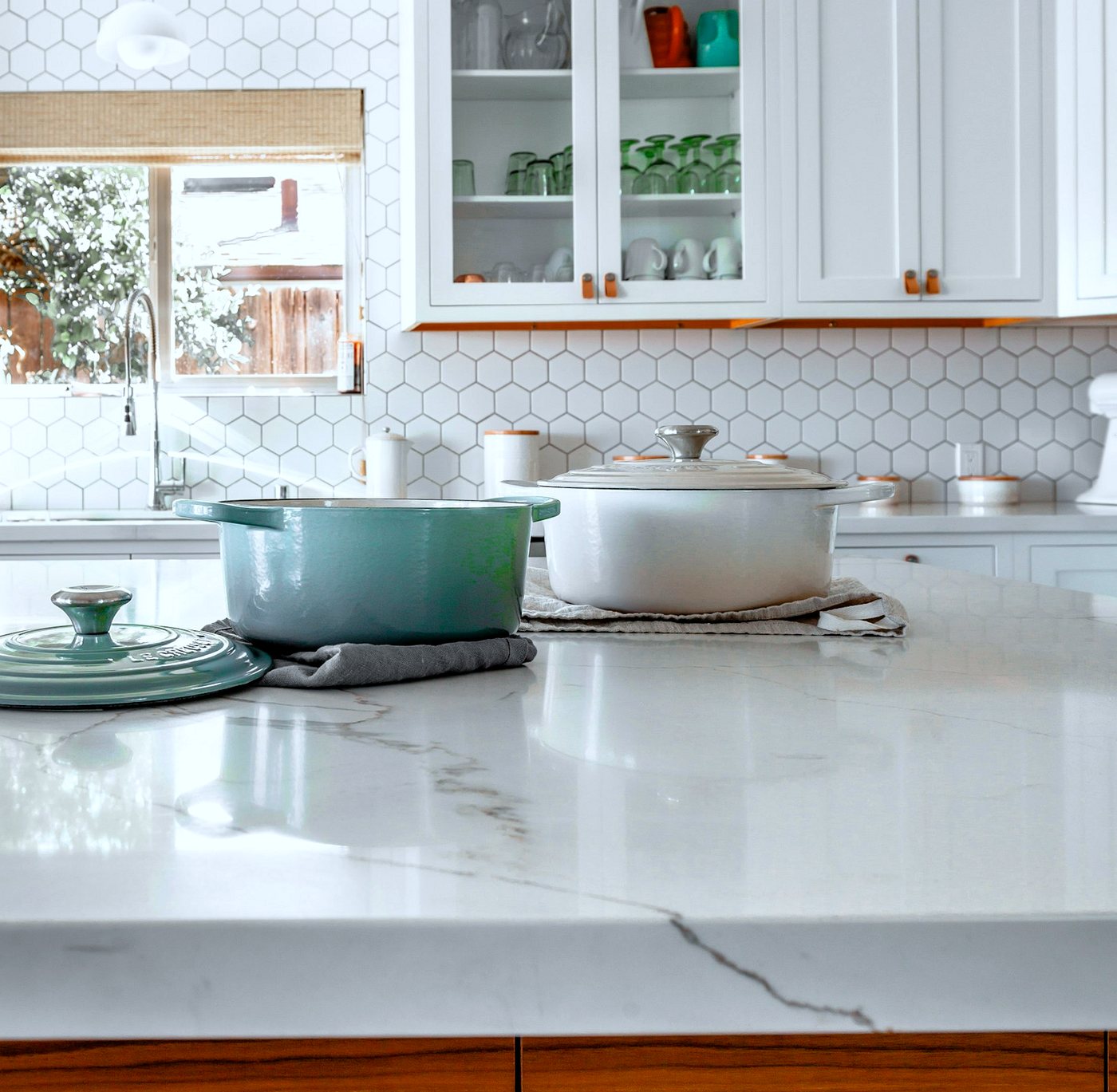 New marble-effect kitchen worktop on a timber-fronted island